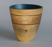 Textured, carved bowl with painted interior